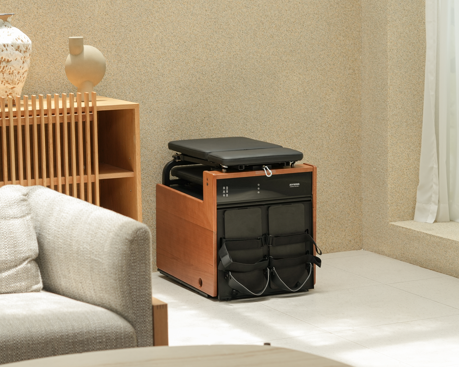 Rowing machine stored in corner for space-saving