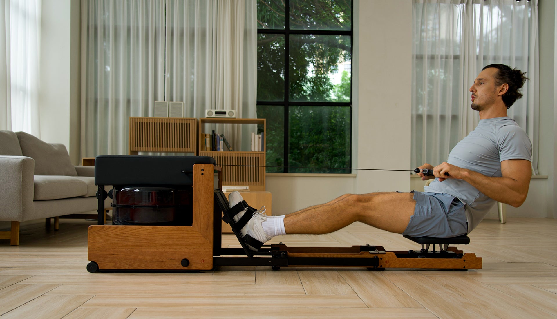 JOYSONG Compact Cube Rower in use during a home rowing session