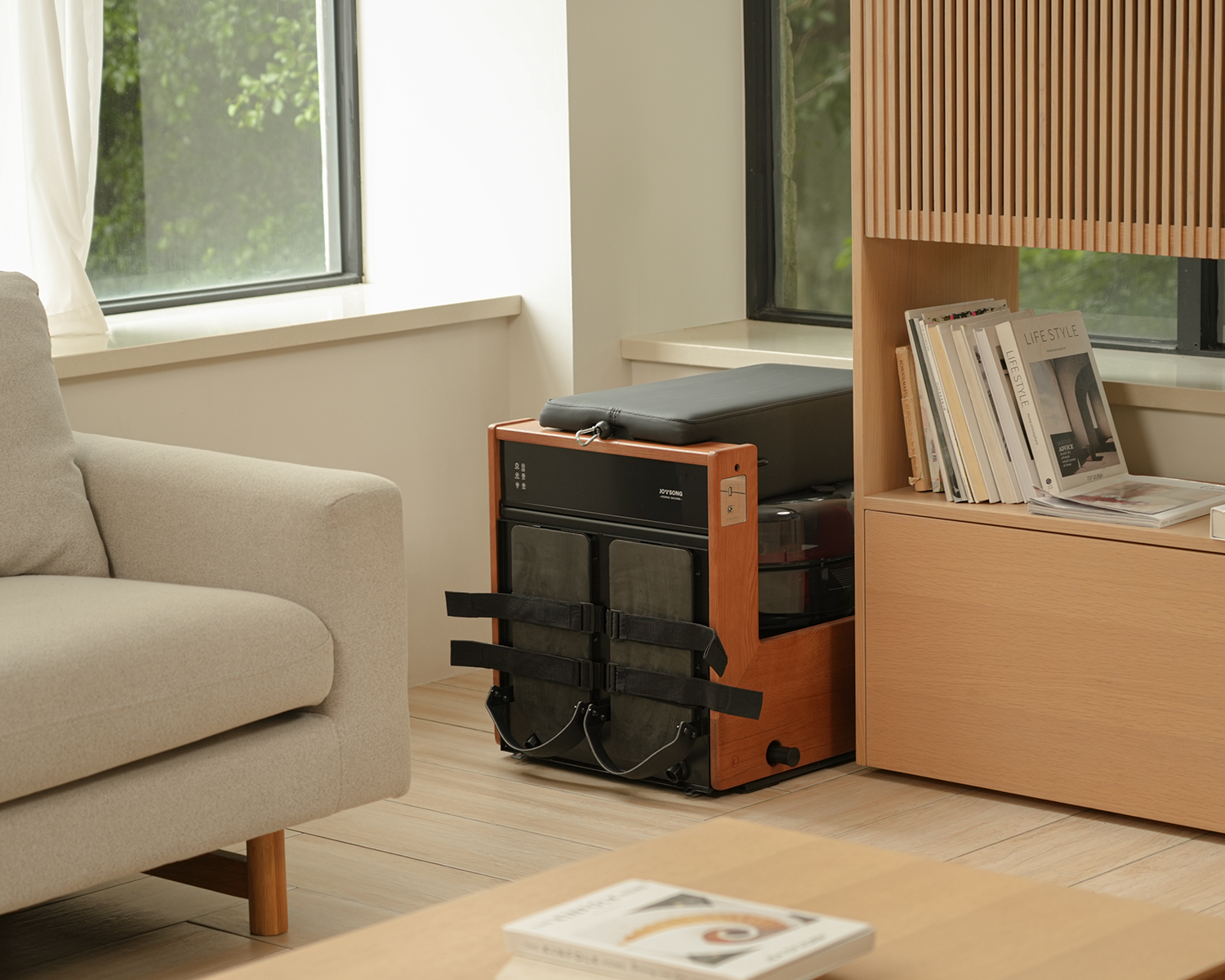 JOYSONG Compact Cube Rower stored upright in the corner of a modern home