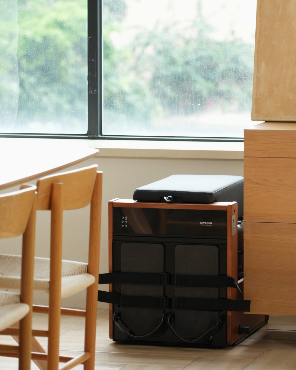 JOYSONG Compact Cube Rower stored upright in a modern home