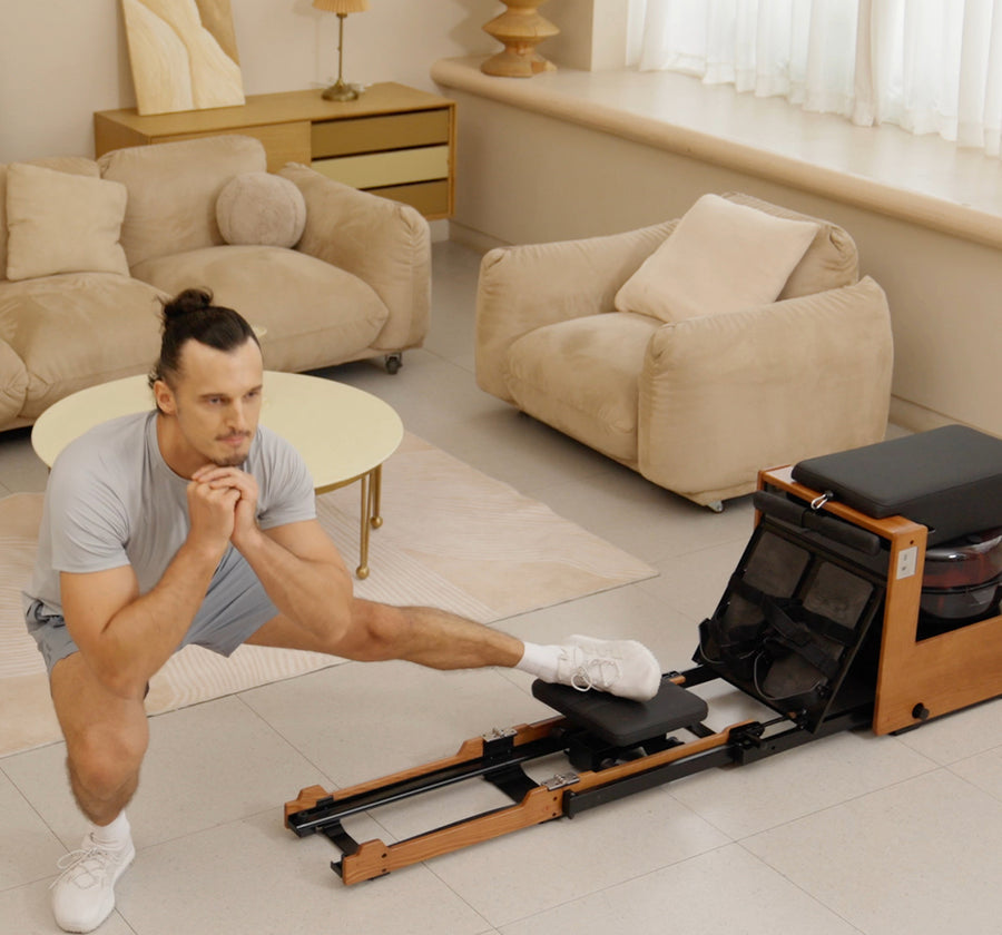 Lateral lunge exercise beside the JOYSONG Compact Cube Rower in a home